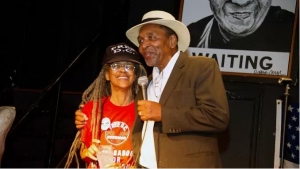 Anise Jenkins and Frank Smith share a moment during the Stand Up! for Democracy in DC Founders&#039; Day event on Aug. 3.