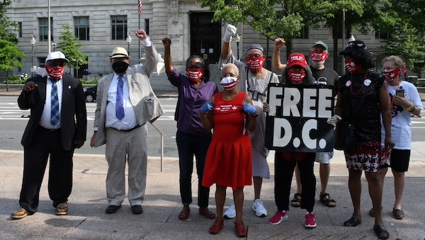  **FILE** D.C. statehood activists hold court in front of the John A. Wilson Building in Northwest.